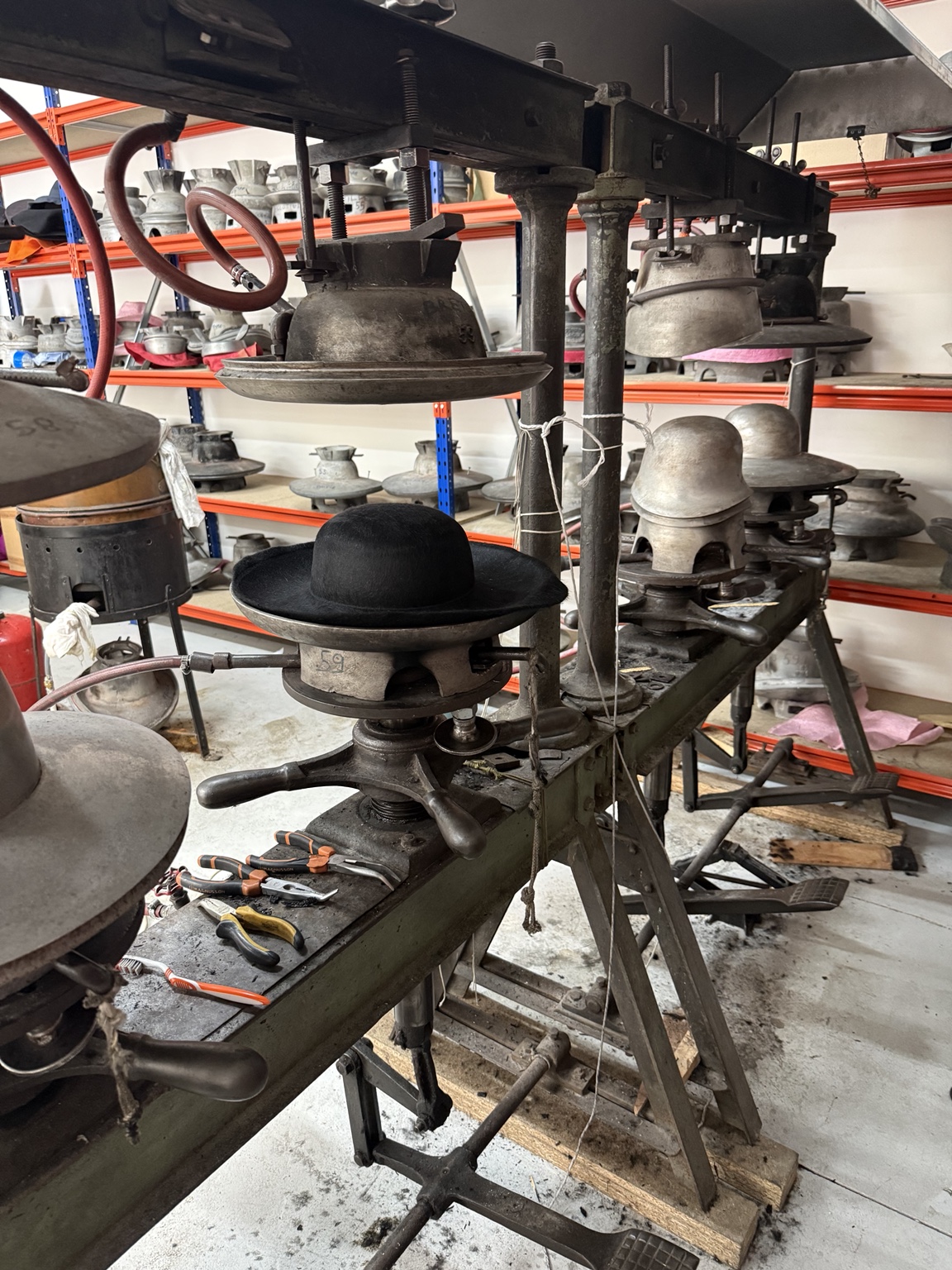 Traclet hatmaking workshop in Roanne with machines and hat blocks